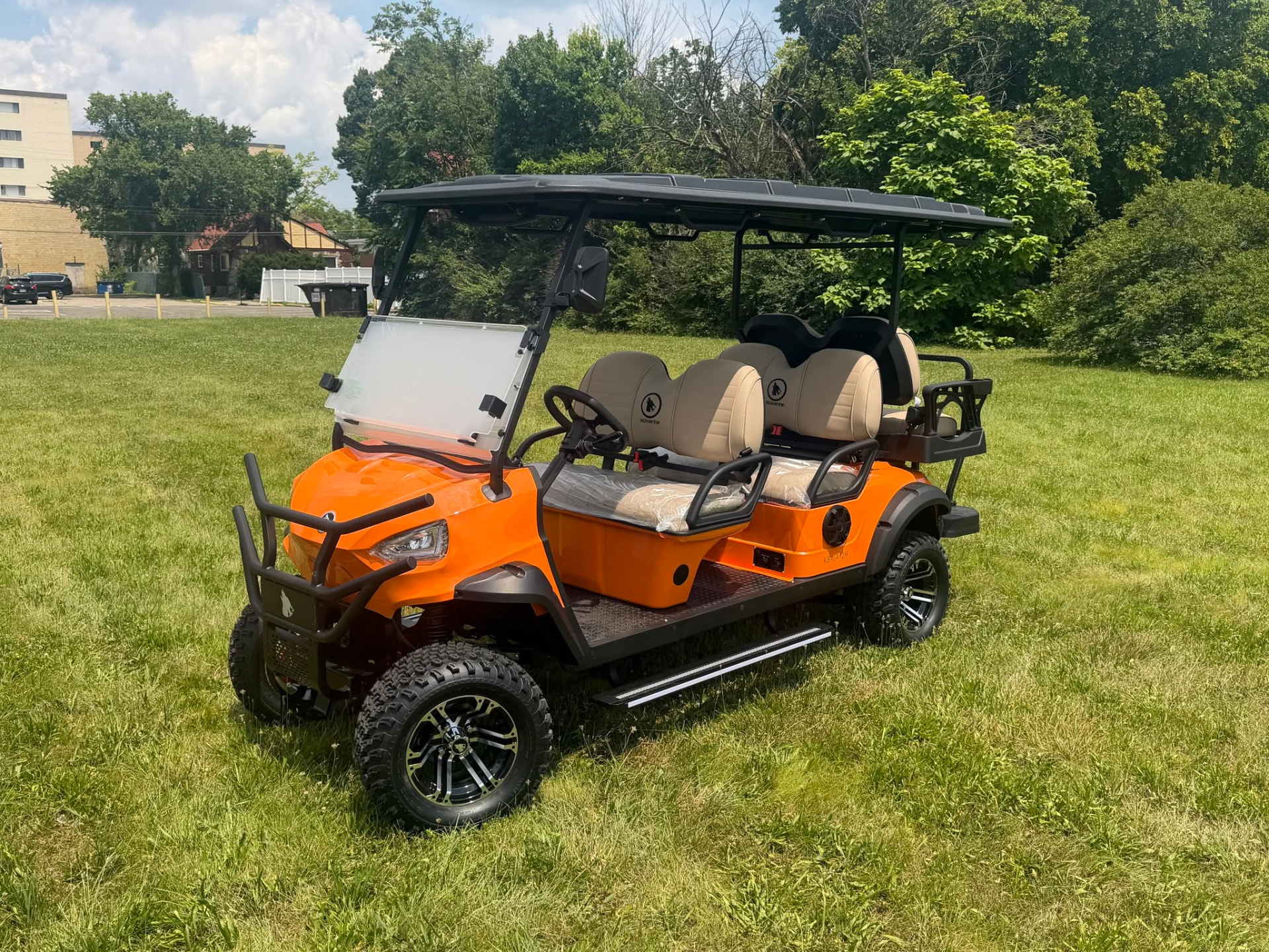 Orange Wolverine golf cart