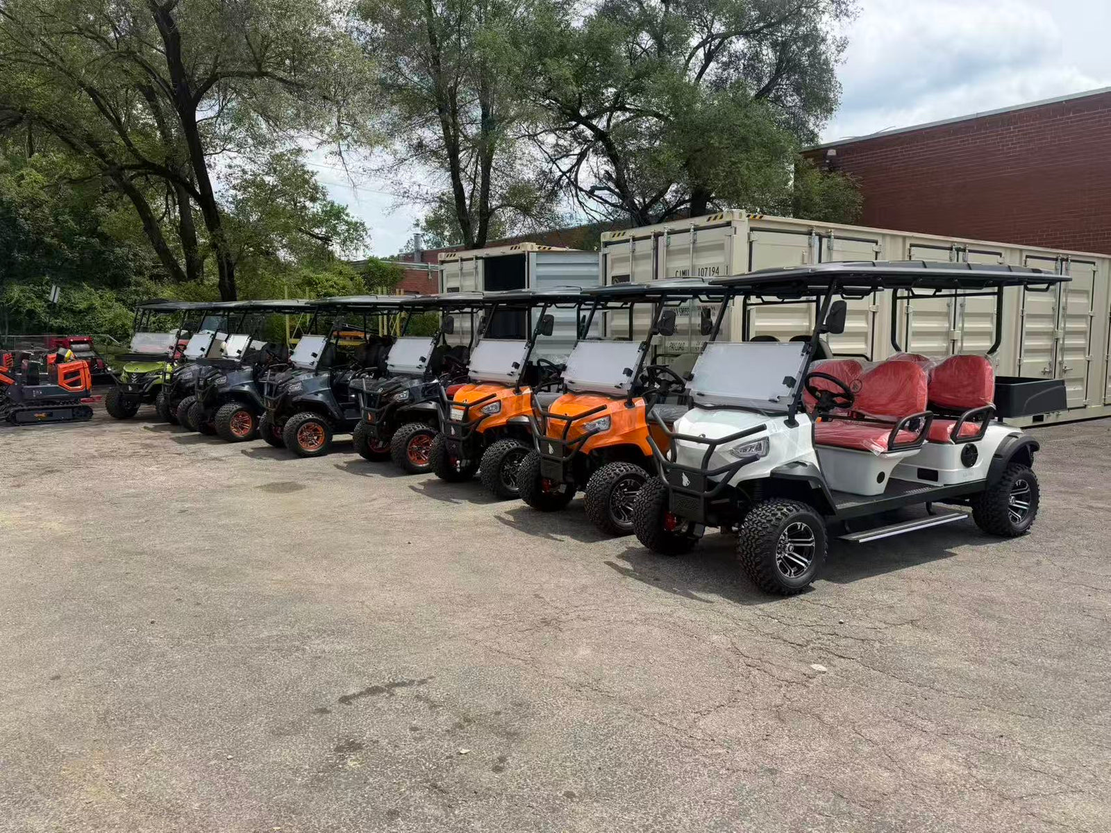 A row of brand-new Wolverine golf carts lined up at the Cincinnati Golf Carts lot